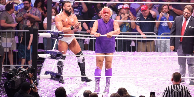 Andrade El Idolo and Ric Flair in action during Ric Flair's Last Match at Nashville Municipal Auditorium on July 31, 2022 in Nashville, Tennessee.
