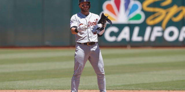Robbie Grossman #8 of the Detroit Tigers reacts after hitting a two-run double in the top of the third inning against the Oakland Athletics during game one of a double header at RingCentral Coliseum on July 21, 2022 in Oakland, California.