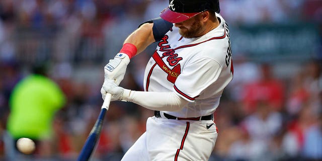 Robbie Grossman of the Atlanta Braves hits a solo home run in the third inning against the New York Mets at Truost Park in Atlanta on August 16, 2022. 