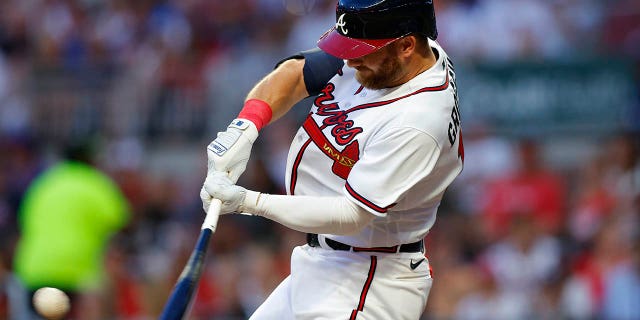 Robbie Grossman of the Atlanta Braves hits a solo homer in the third inning against the New York Mets at Truist Park on August 16, 2022 in Atlanta.