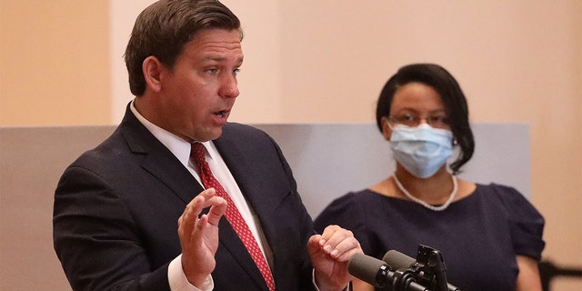 Florida Gov. Ron DeSantis announces the appointment of Renatha Francis, right, a Palm Beach County circuit judge, to the Florida Supreme Court during a news conference in downtown Miami on May 26, 2020.