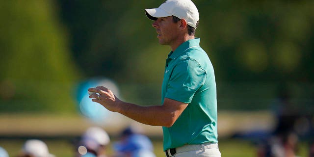 Rory McIlroy of Northern Ireland reacts to the gallery after his putt on the 16th hole during the third round of the BMW Championship golf tournament at Wilmington Country Club Aug. 20, 2022, in Wilmington, Del.