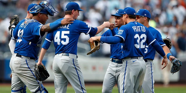 Kansas City Royals relief pitcher Taylor Clarke (45) celebrates with teammates after defeating the New York Yankees 8-6, in New York, Sunday, July 31, 2022. 