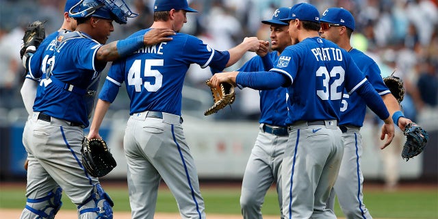 Kansas City Royals relief pitcher Taylor Clarke (45) celebrates with teammates after defeating the New York Yankees 8-6, in New York, Sunday, July 31, 2022.