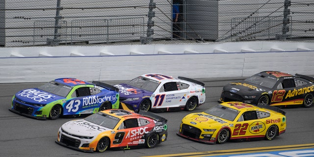 Chase Elliott (9), Erik Jones (43), Denny Hamlin (11), Joey Logano (22) and Ryan Blaney (12) make their way through the front stretch during the Coke Zero Sugar 400 at Daytona International Speedway in Daytona Beach, Florida, on Aug. 28, 2022.
