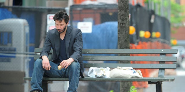 This photo of Keanu Reeves (taken in 2010) went viral after fans were convinced the "Matrix" star was sad.