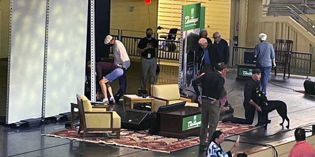 Writer Salman Rushdie (behind the left of the screen) receives treatment after being attacked during a lecture at the Chautauqua Institute in Chautauqua, New York, on Friday, August 12.