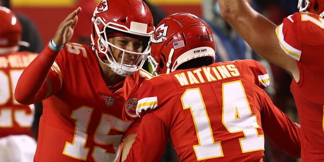 Patrick Mahomes, #15, celebrates a touchdown with teammate Sammy Watkins, #14 of the Kansas City Chiefs, during the second quarter against the Houston Texans at Arrowhead Stadium on September 10, 2020 in Kansas City, Missouri.