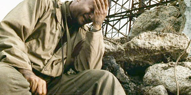 In this scene from the movie "Saving Private Ryan," directed by Steven Spielberg, Tom Hanks (as Captain John H. Miller) takes a moment alone. The powerful wartime drama inspired WWII veteran Jimmy Palermo to open up, finally, to his kids about his horrific wartime experiences.
