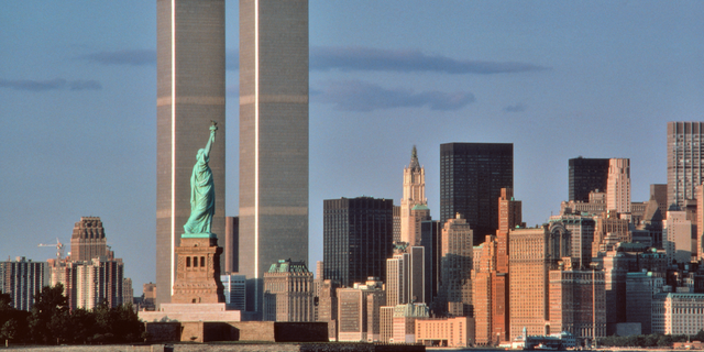 The Statue of Liberty in New York Harbor in the 1980s, showing its relation to the Twin Towers of the World Trade Center. 