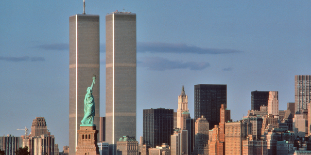 The Statue of Liberty in New York Harbor in the 1980s, showing its relation to the Twin Towers of the World Trade Center.