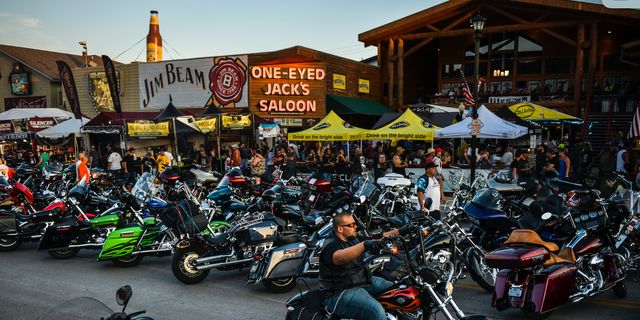 Motorcyclists drive down Main Street during the 80th Annual Sturgis Motorcycle Rally on August 7, 2020. That year, the event attracted nearly 500,000 visitors despite the threat of COVID-19. 