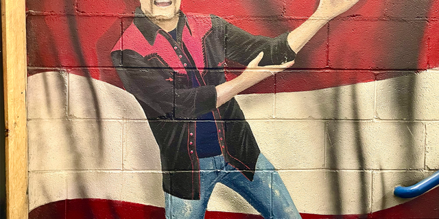 A mural of John Rich invites guests upstairs at Redneck Riviera, the country music star's multilevel entertainment venue in the heart of Nashville.