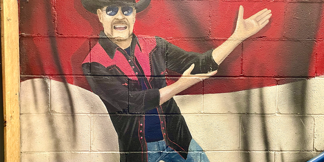 A mural of John Rich invites guests upstairs at Redneck Riviera, the country music star's multilevel entertainment venue in the heart of Nashville.