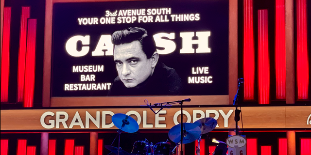 Johnny Cash's image is seen everywhere in the Music City, including in this ad during a Grand Ole Opry performance promoting Cash sites in downtown Nashville.