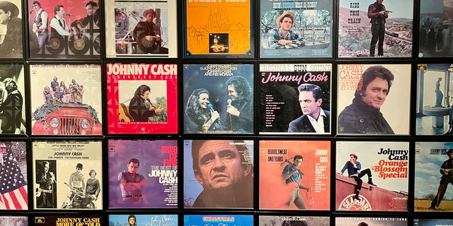 A small portion of a wall of album covers at the Johnny Cash Museum in Nashville. Across from the album covers is a display of vinyl records representing Cash's incredible 134 Billboard hit singles. 