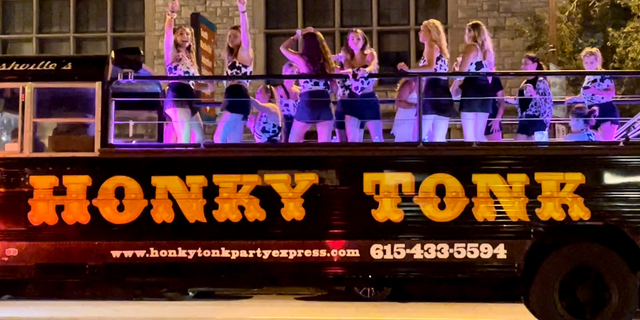 The Honky Tonk Party Express rolls down Broadway in Nashville on Friday, August 26, 2022. Nashville is one of America's top destinations for bachelorette parties; it offers an array of party buses and other mobile entertainment options. 