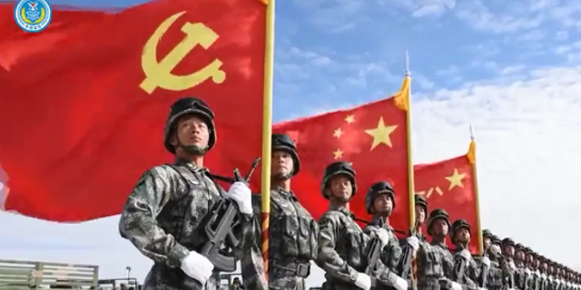 Chinese soldiers with Chinese flag in the background