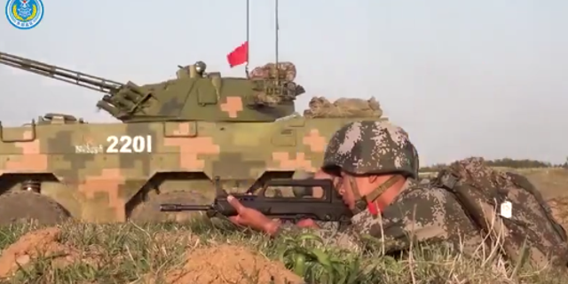 Screenshot of a soldier with the Chinese military in a Chinese People's Liberation Army propaganda video posted on Chinese state media.