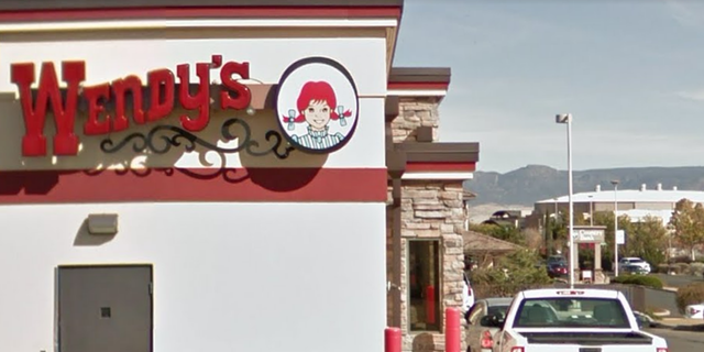 A Wendy's employee has been arrested after allegedly punching a 67-year-old in the head.