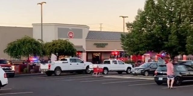 Oregon police respond to a shooting at a Safeway grocery store.