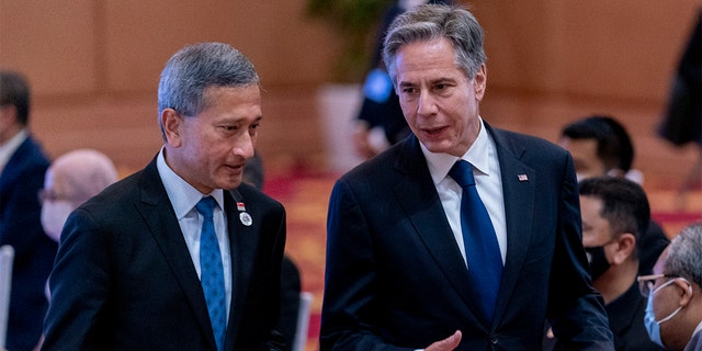 Singapore Foreign Minister Vivian Balakrishnan, left, speaks with Secretary of State Antony Blinken during a US ministerial meeting at the Sokha Hotel in Phnom Penh, Cambodia on Thursday, August 4, 2022.