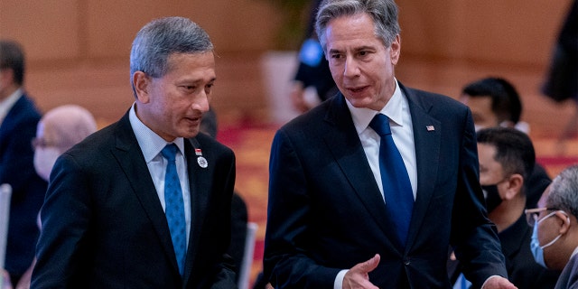 Singapore Foreign Minister Vivian Balakrishnan, left, speaks with Secretary of State Antony Blinken during a U.S. ministerial meeting at the Sokha Hotel in Phnom Penh, Cambodia, on Thursday, Aug. 4, 2022.