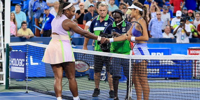 Serena Williams, left, shakes hands with Emma Raducanu of Britain after their match during the Western &amp; Southern Open tennis tournament on Aug. 16, 2022, in Mason, Ohio.