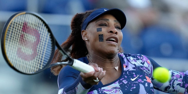 Serena Williams  returns the ball during her quarterfinal doubles tennis match with Ons Jabeur of Tunisia against Shuko Aoyama of Japan and Hao-Ching of Taiwan at the Eastbourne International tennis tournament in Eastbourne, England, Wednesday, June 22, 2022. 