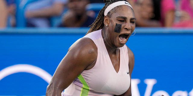 Serena Williams reacts after winning a point against Emma Raducanu of Britain during the Western &amp; Southern Open tennis tournament on Aug. 16, 2022, in Mason, Ohio.