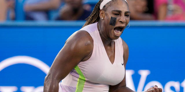 Serena Williams reacts after winning a point against Emma Raducanu of Britain during the Western &amp; Southern Open tennis tournament on Aug. 16, 2022, in Mason, Ohio.