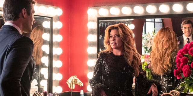 Shania Twain stands in a dressing room after a performance on the country music show, "Monarch." 