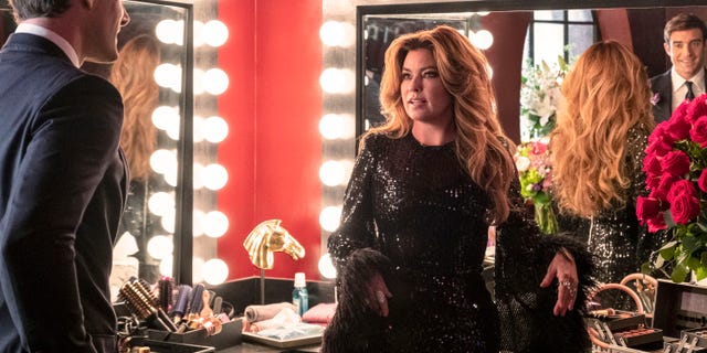 Shania Twain stands in a dressing room after a performance on the country music show "Monarch."