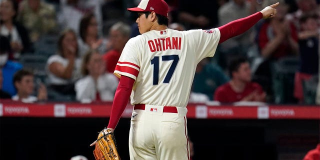 Los Angeles Angels starting pitcher Shohei Ohtani reacts after Oakland Athletics' Vimael Machin was thrown out at third base after a single by Tony Kemp during the fifth inning of a baseball game Wednesday, Aug. 3, 2022, in Anaheim, Calif.