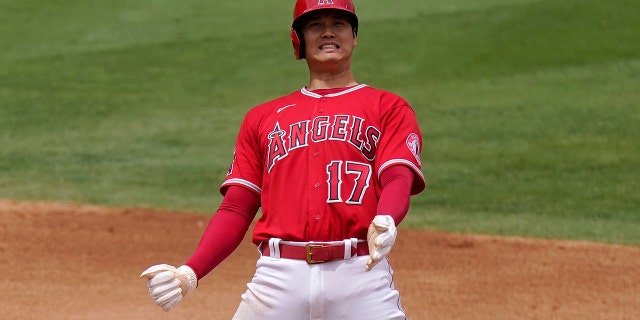 Los Angeles Angels' Shohei Ohtani reacts after being tagged out while trying to steal second during the third inning of a baseball game against the Texas Rangers Sunday, July 31, 2022, in Anaheim, Calif.