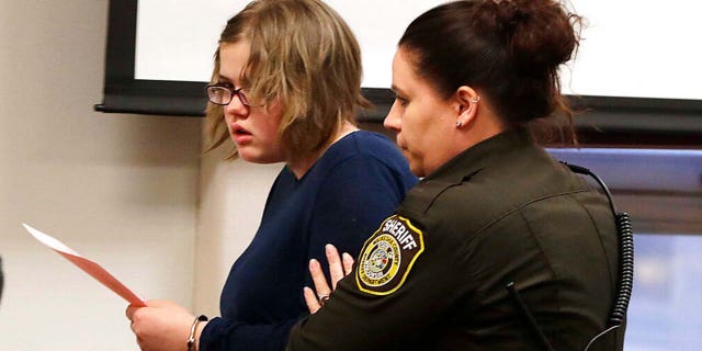 Morgan Geyser is escorted out of the courtroom following her sentencing.