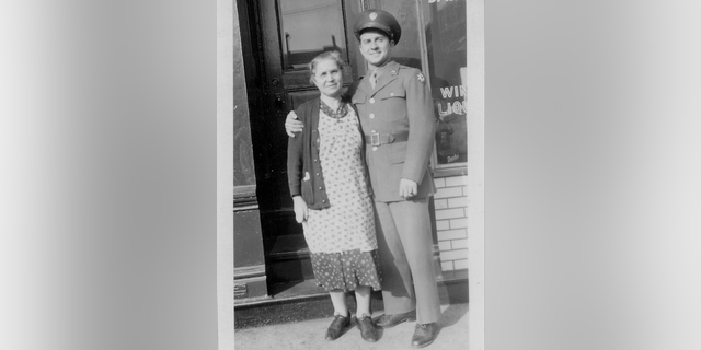 Jimmy Palermo in his Army dress uniform, Jan. 1943, with his mother Mary outside the tavern in St. Louis as he prepares to set off for Europe in WWII.