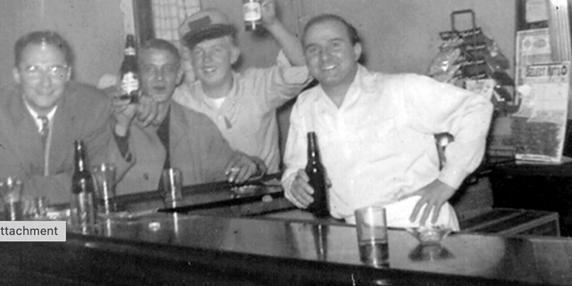 Jimmy Palermo (at right, in white shirt) serves patrons from behind the bar at Palermo's Tavern. The sports-themed pub in St. Louis stakes a strong claim as America's first-ever sports bar. 