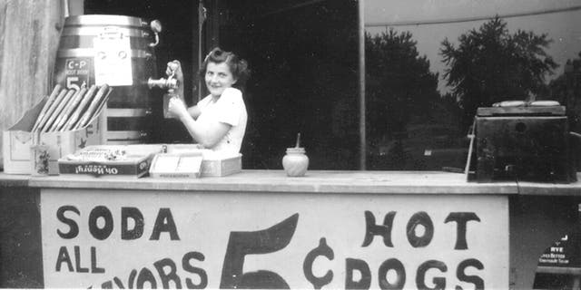 Rose Palermo (who married into the family) pours soda at the hot dog stand outside Palermo's Tavern. The pub, across from former St. Louis Major League Baseball stadium Sportsman's Park, is considered America's first sports bar.