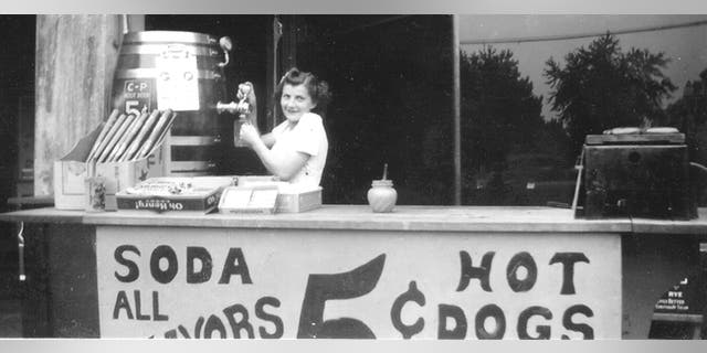 Rose Palermo (who married into the family) pours soda at the hot dog stand outside Palermo's Tavern. The pub, across from former St. Louis Major League Baseball stadium Sportsman's Park, is considered America's first sports bar.