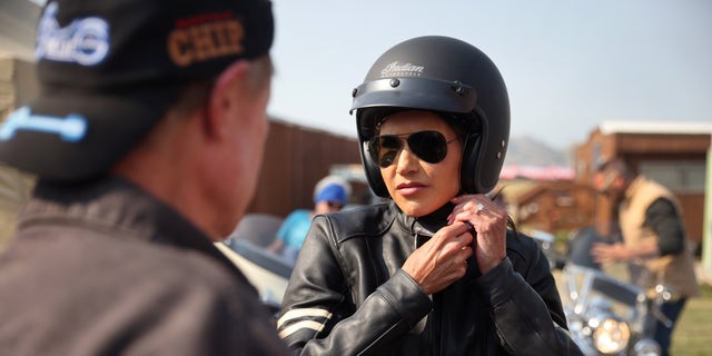 Gov. Kristi Noem of South Dakota arrives at the Sturgis Buffalo Chip campground on Aug. 9. 2021, after riding in the Legends Ride for charity on a 2021 Indian Chief in Sturgis, South Dakota. 