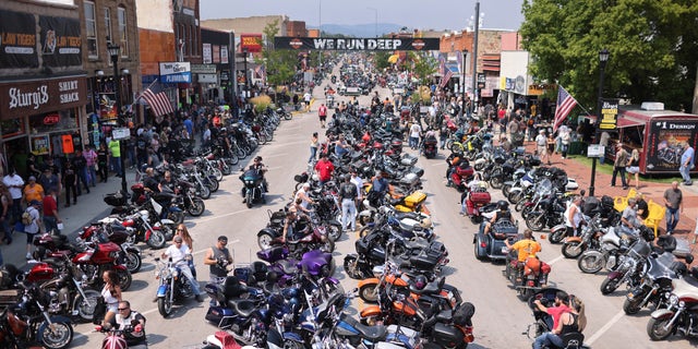 Motorcycle enthusiasts attend the 81st annual Sturgis Motorcycle Rally on August 8, 2021, in Sturgis, South Dakota. 