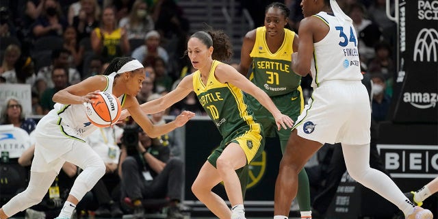 Seattle Storm guard Sue Bird (10) defends as Minnesota Lynx guard Moriah Jefferson, left, drives toward the basket during the first half of a WNBA basketball game Wednesday, Aug. 3, 2022, in Seattle.