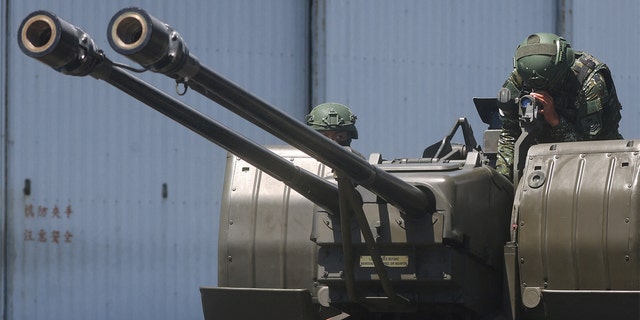 Soldiers demonstrate a GDF-006 anti-aircraft gun to the media in Hualien, Taiwan, Aug. 18, 2022. 