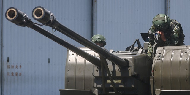 Soldiers demonstrate a GDF-006 anti-aircraft gun to the media in Hualien, Taiwan, Aug. 18, 2022.