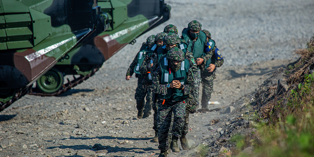 Soldiers disembark from AAV7 amphibious assault vehicles during the Han Kuang military exercise, which simulates China's People's Liberation Army (PLA) invading the island, on July 28, 2022, in Pingtung, Taiwan.