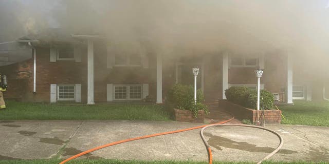 Tennessee house catches fire, neighbors use trampoline to save occupants 2 A Tennessee home caught fire, trapping two people in the second story before neighbors helped them to safety.