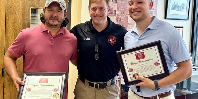 Fernando Rivera (left), Fire Chief Phil Hyman (center) and Sam Triplett (right).