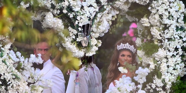 Teresa Giudice and Luis Ruelas arrive at the floral altar before saying "I do."