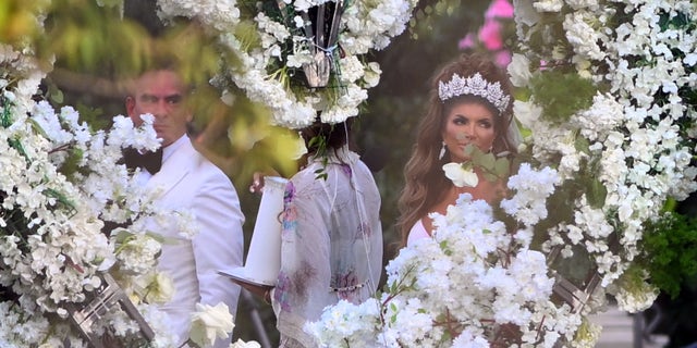 Teresa Giudice and Luis Ruelas arrive at the floral altar before saying "I do."